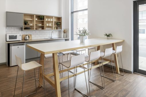 Room with table and chair at Portland Green Student Village