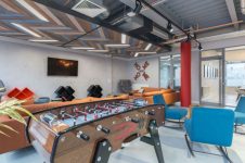 Games Area & Social Lounge with chair and table at Livin - Cardiff